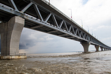 Most extensive Padma bridge photography under the dark cloudy sky