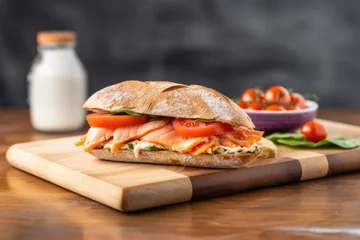 Fototapeten a bagel sandwich with cream cheese and smoked salmon on a modern board © Alfazet Chronicles