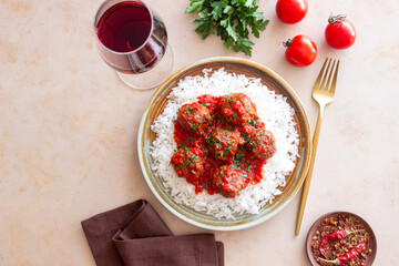 Rice with meatballs in tomato sauce. Italian food.