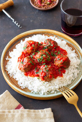 Rice with meatballs in tomato sauce. Italian food.