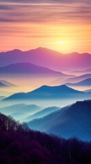 Fototapeta premium Mountains at sunset with fog