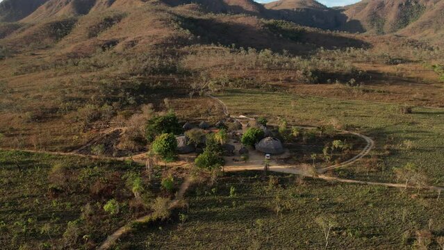 aerial view a beauty village in Chapada dos Veadeiros "Aldeia Macaco" hollow-shaped bioconstruction houses cerrado landscape Goi&aacute;s Brazil