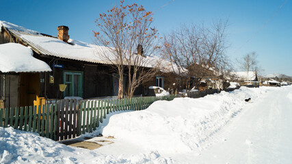 A village in the Russian outback. Old leaning houses in the Far East of Russia. The once thriving timber farm is falling into disrepair and the village is dying.
