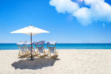 Sunbeds and umbrella on a tropical beach