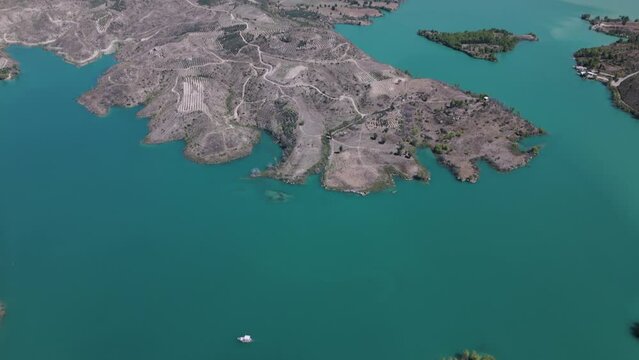 Establishing aerial view over Green lake scenic turquoise water in the Taurus mountains of Turkey