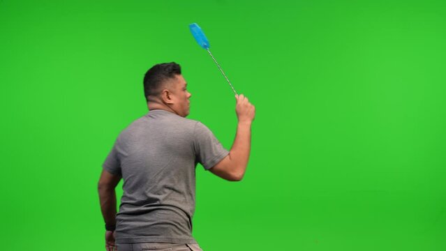 Asian man with fly swatter 