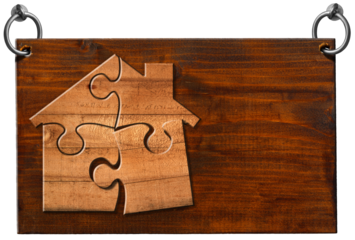 Wooden sign with a wooden house made of puzzle pieces and copy space, and steel rings for hanging. Isolated on white or transparent background and copy space, template. Png.
