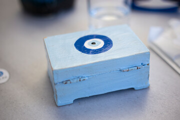 Blue wooden secret treasury box with blue magic eye