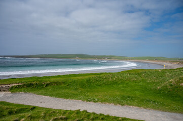 Beach and sea next to Skara Brae prehistoric village, Orkney Island, Scotland