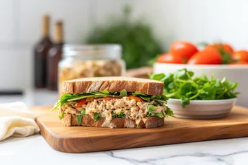 Gordijnen tuna salad sandwich with salad in the background © Natalia