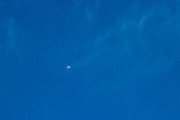 moon on the day with blue sky