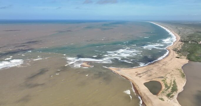 Aerial flying backwards from river mouth of Doce River and Atlantic Ocean, Brazil