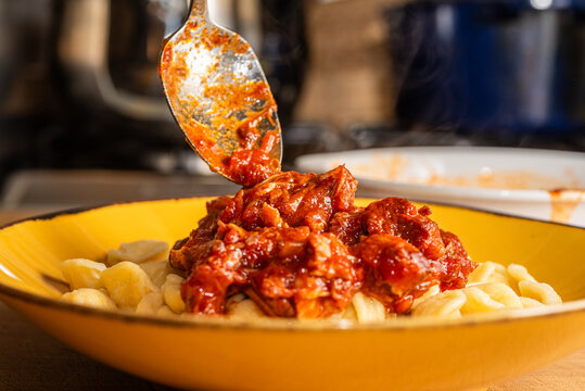 Serving Neapolitan Rag&ugrave; On Pasta