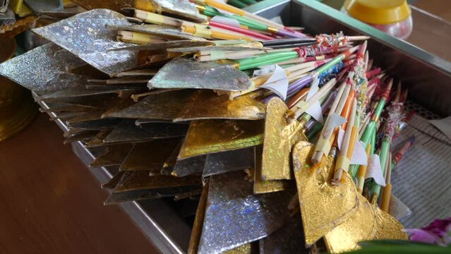 Incense and Candle with Golden Silver Lotus Paper in Temple
