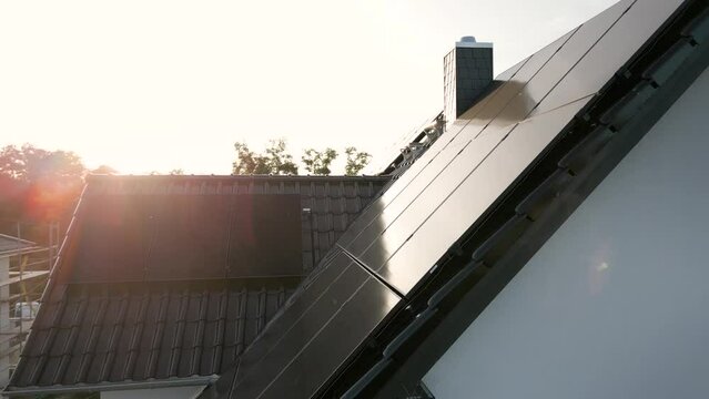 Solar panels on the roof of a modern single-family house