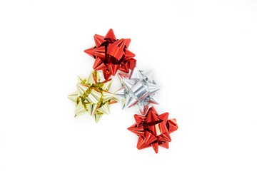 Red, silver and golden bows isolated on white background. Top view of gift bows.