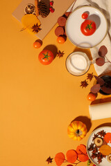 Concept of fall season and Thanksgiving day with fruits, spices and autumn leaves on yellow...