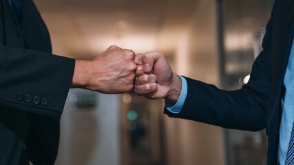 Business people handshake of partners at the office desk. Discussion among businesspeople on the latest developments.