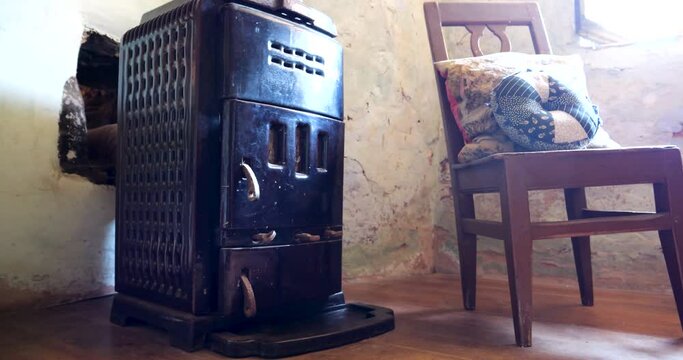 In the troglodyte rock house, an antique wooden stove takes center stage, capturing the essence of living as our forebears did