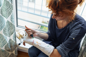 Fun creative fun to draw on plaster cast on broken arm