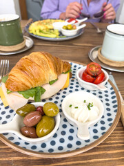 breakfast with croissant and coffee
