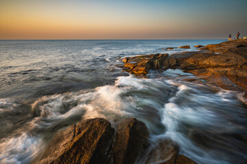 Sunset at a rocky shore in New England
