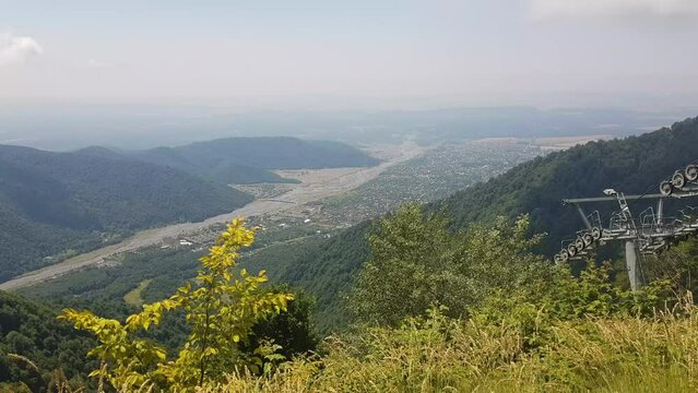 Gondola Lift Moving Above Qebele City Azerbaijan on Sunny Summer Day, Tufandag Mountain Resort