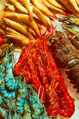 Seafood market. Fresh, delicious seafood, shrimps, crayfish and lobster. Close-up. Concept of seafood, delicious taste, marine life, organic products. Copy space for ad