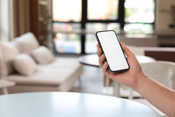 Man using mobile phone indoors, closeup. Space for text