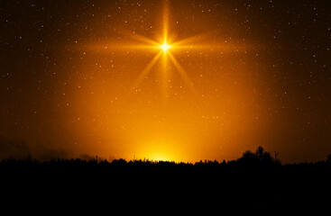 Christmas star. Background of the beautiful nite golden starry sky and bright star. Concept Nativity of Jesus Christ - 657556613