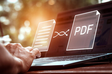 Convert PDF files with online programs. Users convert document files on a platform using an internet connection at desks. concept of technology transforms documents into portable document formats. - obrazy, fototapety, plakaty