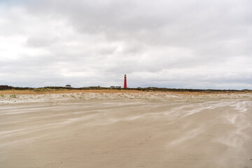 panorama panorama view on red lighthouse fom the beach of dutch island schiermonnikoog