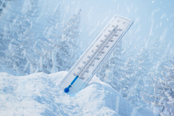 The thermometer at the snowdrift in the beautiful white snowy environment.