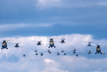 MOSCOW, RUSSIA - MAY 7, 2021: Avia parade in Moscow. Mi-26 and Mi-8AMTK helicopters fly in the sky on parade of Victory in World War II in Moscow, Russia