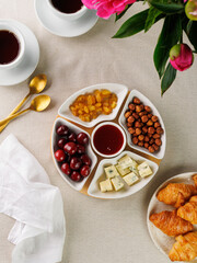 Cafe or bar table with desserts and tea. English Afternoon Tea ceremony, Five O'clock, copy space for your text