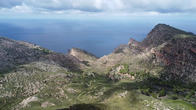 Scenic drone footage of the Coll de Sa Gramola, Mallorca. Fascinating aerial views of landscape, mountains, rocks and seaside.