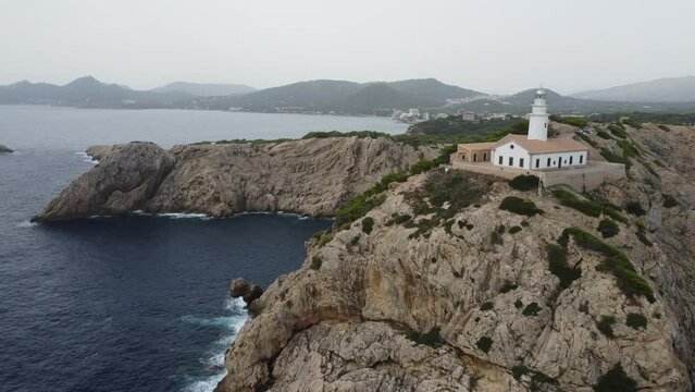 Scenic drone footage of the Faro de Capdepera, Mallorca. Fascinating aerial views of landscape, mountains, rocks and seaside.