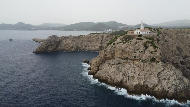 Scenic drone footage of the Faro de Capdepera, Mallorca. Fascinating aerial views of landscape, mountains, rocks and seaside.