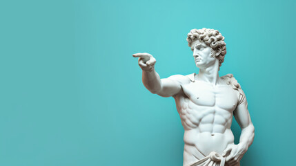 Sculpture or statue of David pointing and looking on a blue background - obrazy, fototapety, plakaty