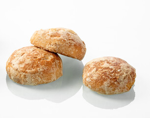 Russian gingerbread-sweet buns on a white mirror background