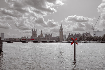 River Thames with buildings of Parliament with Big Ben tower in the distance- London UK.