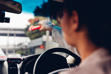 Woman use Safety Hammer and Seatbelt Cutter in Cars, break glass When emergency. In case of...