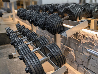 close-up rows of dumbbells in gym