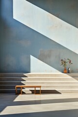 Minimalist geometric shapes casting shadows on concrete wall