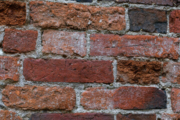A brick wall in close-up. Red brick. Ancient masonry.