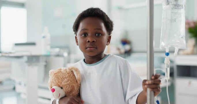 African child, sick in hospital and teddy bear for healthcare, wellness or treatment on iv drip. Portrait, serious and face of kid in pediatric clinic with toys for recovery from surgery or healing