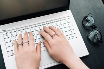 Versatile Work Environment. Woman's Hands Typing on Computer Keyboard in Office Panoramic Banner, Embracing Online Learning, Internet Marketing, and Freelance from Home.