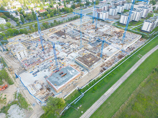 Aerial Bird Eye View Of a Construction Site Building Cranes Looking Down Industrial Machinery Area...
