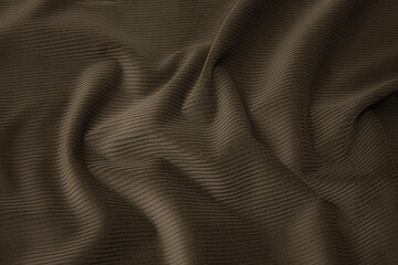 The texture of the cotton fabric is velveteen beige. Background, pattern.
