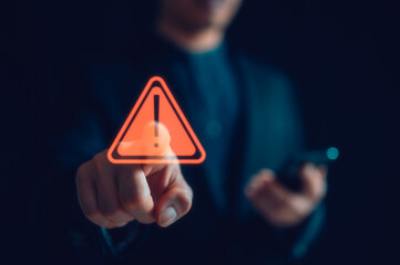 Hand showing red triangle caution warning sign for maintenance notification error and risk concept,...